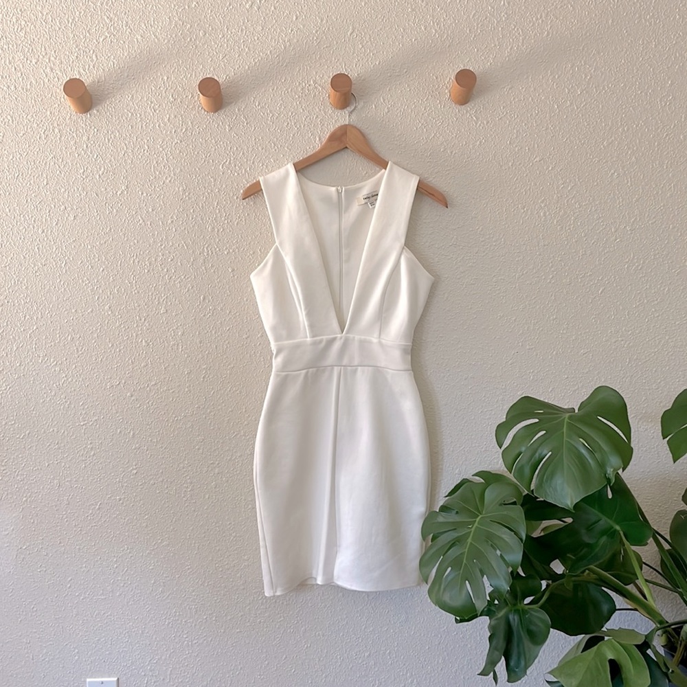 Low V body con mini dress. Size 6. Brand: Twin sisters.